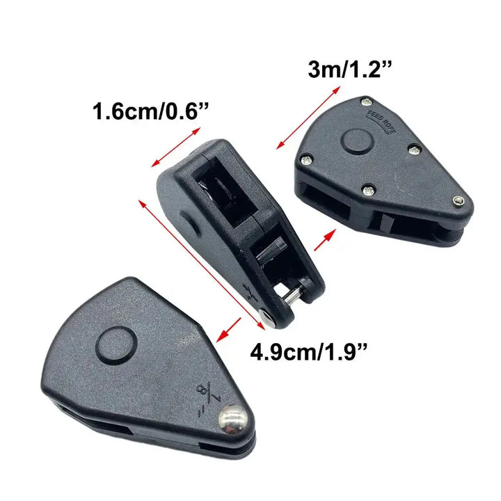 Black plastic pulley tensioner for camping tent ropes with dimensions labeled in centimeters and inches.