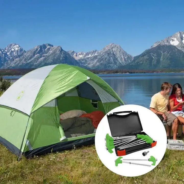 Green camping tent by lake with metal stakes set, scenic mountain view in background